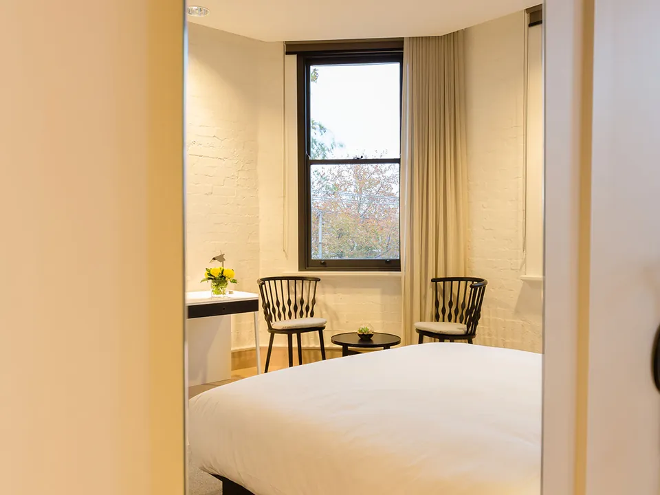 Boutique guest room with bay window at the Coppersmith Hotel, South Melbourne